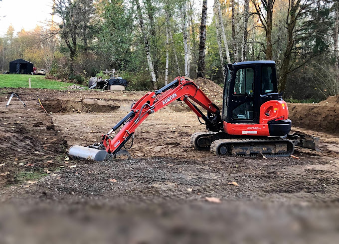 An excavator preparing site in Albany, NY